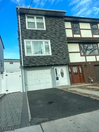 a front view of a house with a garage
