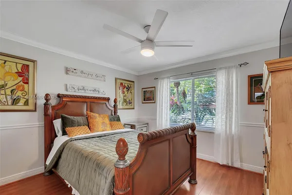 a bed room with a bed and a window