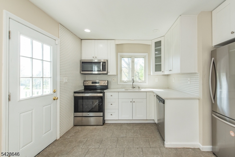 537 Dell Road Mount Arlington, NJ 07850 - Photo 12 of 23 a kitchen with a refrigerator stove and sink
