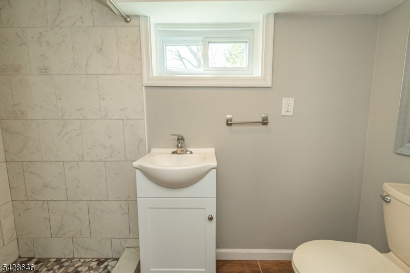 537 Dell Road Mount Arlington, NJ 07850 - Photo 18 of 23 a bathroom with a toilet sink and mirror