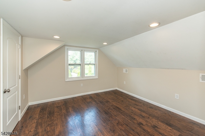 537 Dell Road Mount Arlington, NJ 07850 - Photo 2 of 23 wooden floor in an empty room with a window