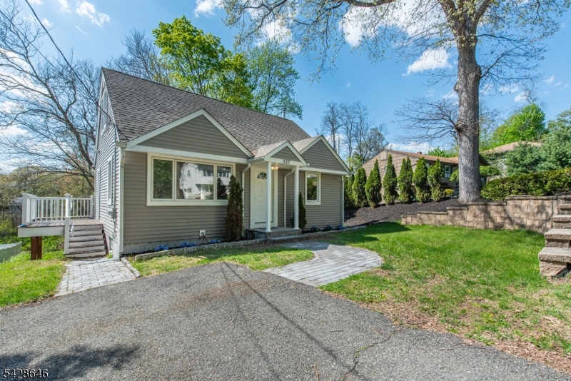 537 Dell Road Mount Arlington, NJ 07850 - Photo 22 of 23 a view of a house with a yard and large tree