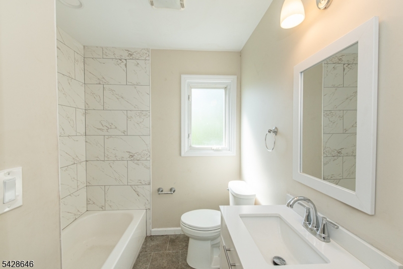 537 Dell Road Mount Arlington, NJ 07850 - Photo 8 of 23 a bathroom with a sink toilet and shower