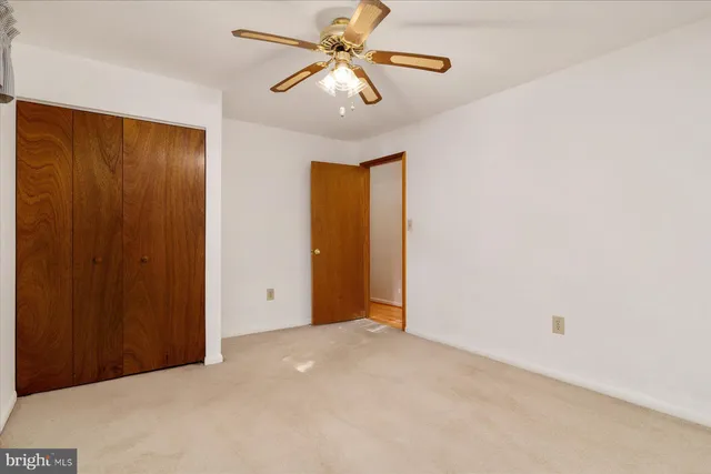 a kitchen with a sink and a mirror