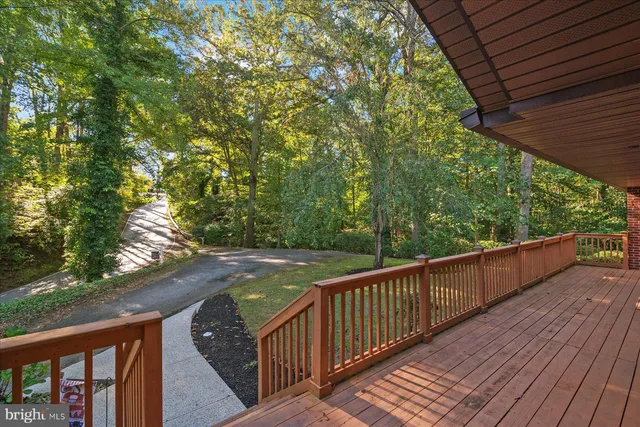 a view of room with window and a ceiling fan