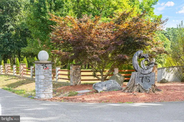 a living room with furniture and a book shelf
