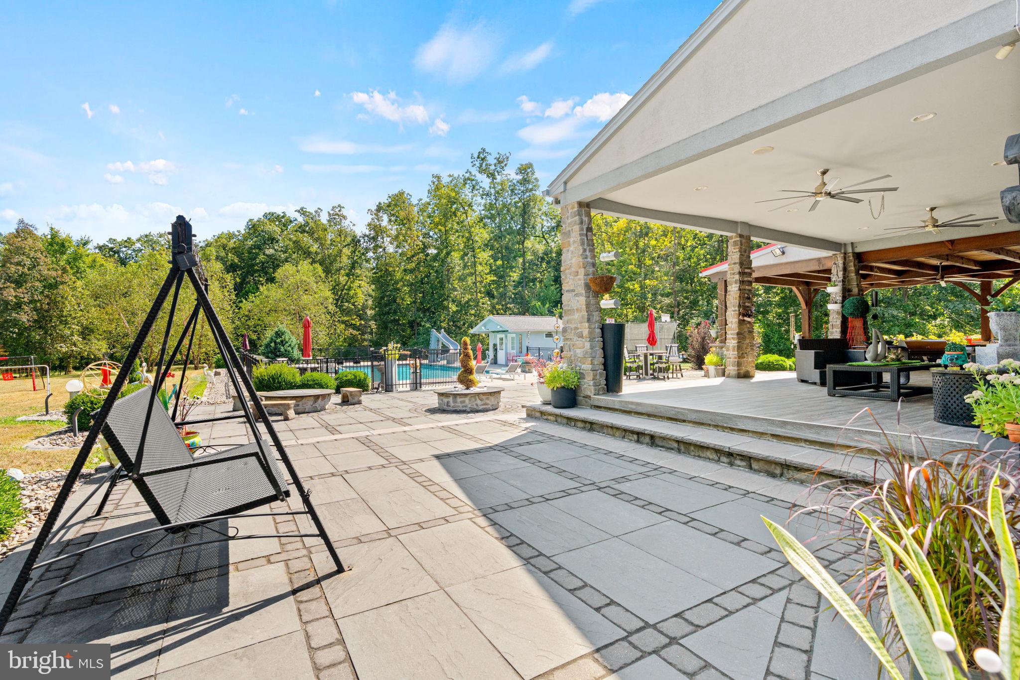 75 Cavalry Field Road Gettysburg, PA 17325 - Photo 95 of 147 a view of a patio with a table and chairs under an umbrella