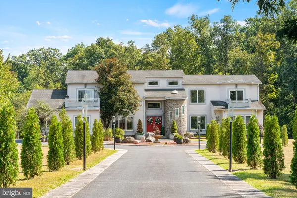 a large kitchen with stainless steel appliances granite countertop a stove and a refrigerator
