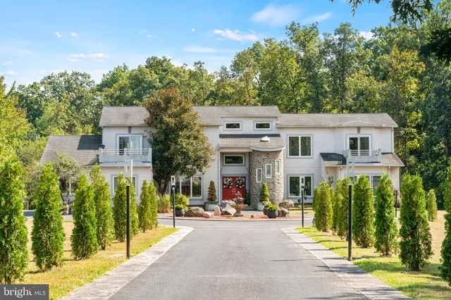 a large kitchen with stainless steel appliances granite countertop a stove and a refrigerator
