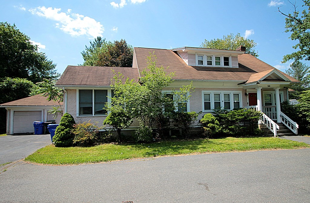 1644 Allen Street Springfield, MA 01118 - Photo 1 of 27 a front view of a house with a yard and garage