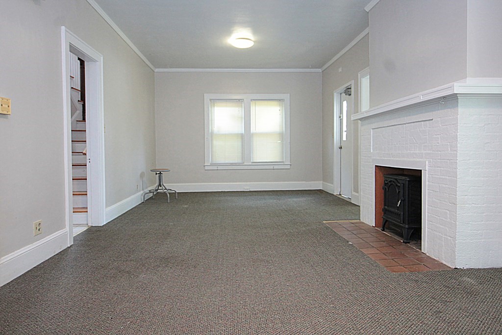 1644 Allen Street Springfield, MA 01118 - Photo 16 of 27 an empty room with windows and fireplace