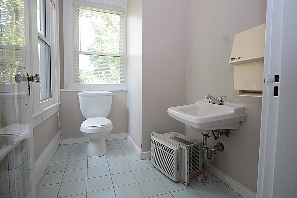 1644 Allen Street Springfield, MA 01118 - Photo 21 of 27 a bathroom with a sink toilet and a mirror