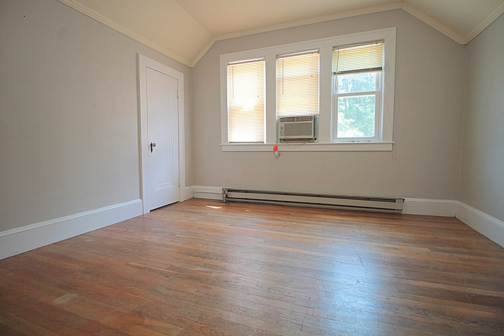 1644 Allen Street Springfield, MA 01118 - Photo 24 of 27 an empty room with wooden floor and windows