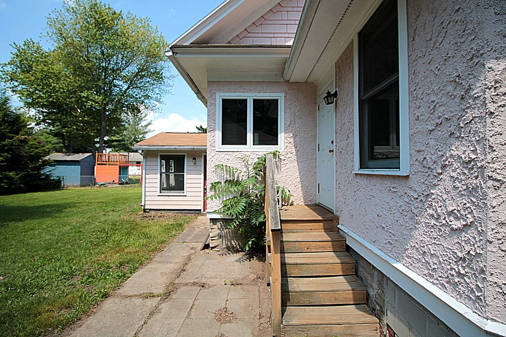 1644 Allen Street Springfield, MA 01118 - Photo 6 of 27 a front view of a house with garden