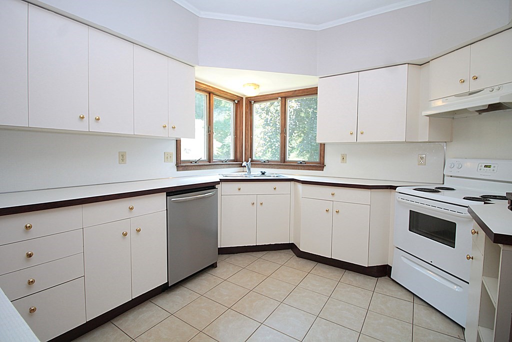 1644 Allen Street Springfield, MA 01118 - Photo 7 of 27 a kitchen with cabinets appliances a sink and a window