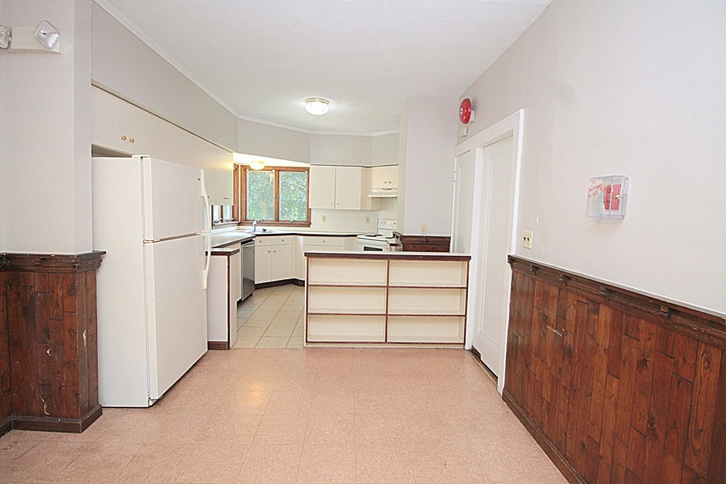 1644 Allen Street Springfield, MA 01118 - Photo 8 of 27 a kitchen with white cabinets and refrigerator
