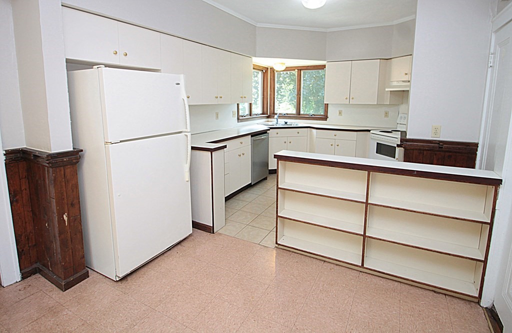 1644 Allen Street Springfield, MA 01118 - Photo 9 of 27 a kitchen with a refrigerator and a sink