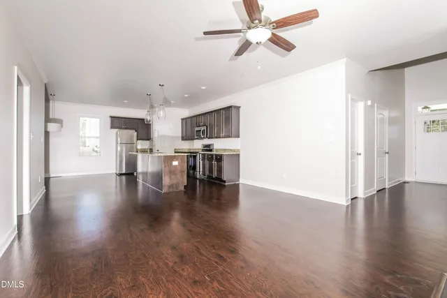 a view of kitchen with furniture and wooden floor