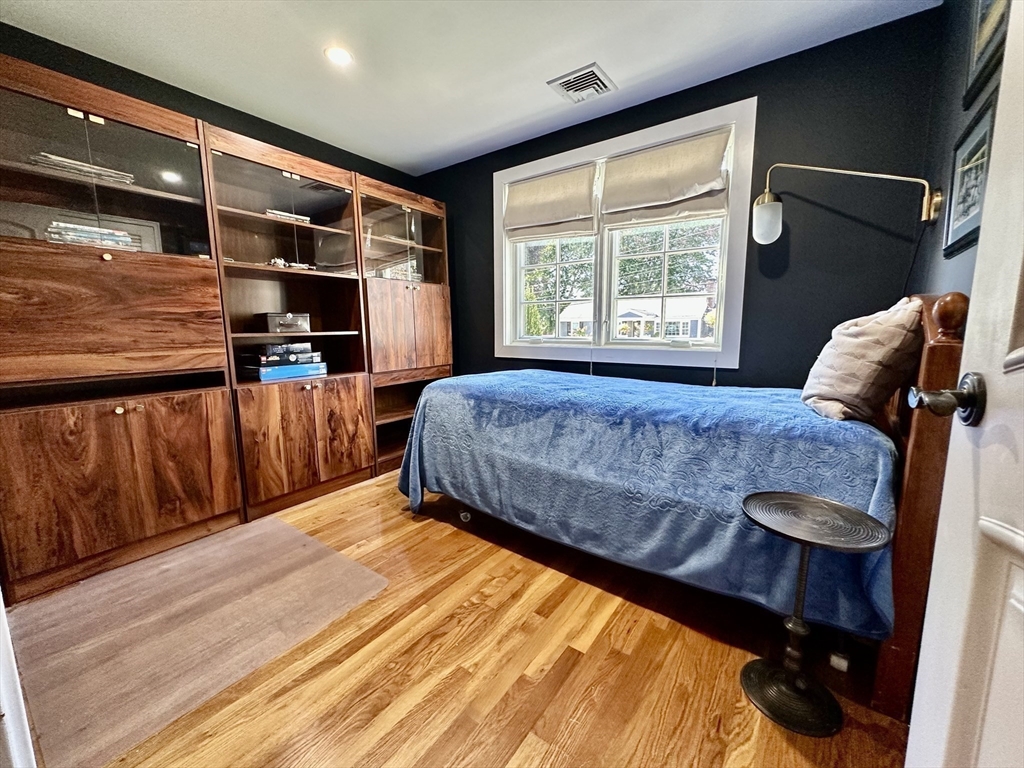 3 Day Circle Woburn, MA 01801 - Photo 11 of 42 a bedroom with a bed and wooden floor