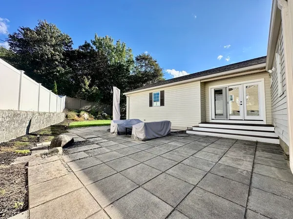 a view of a backyard with a sitting area