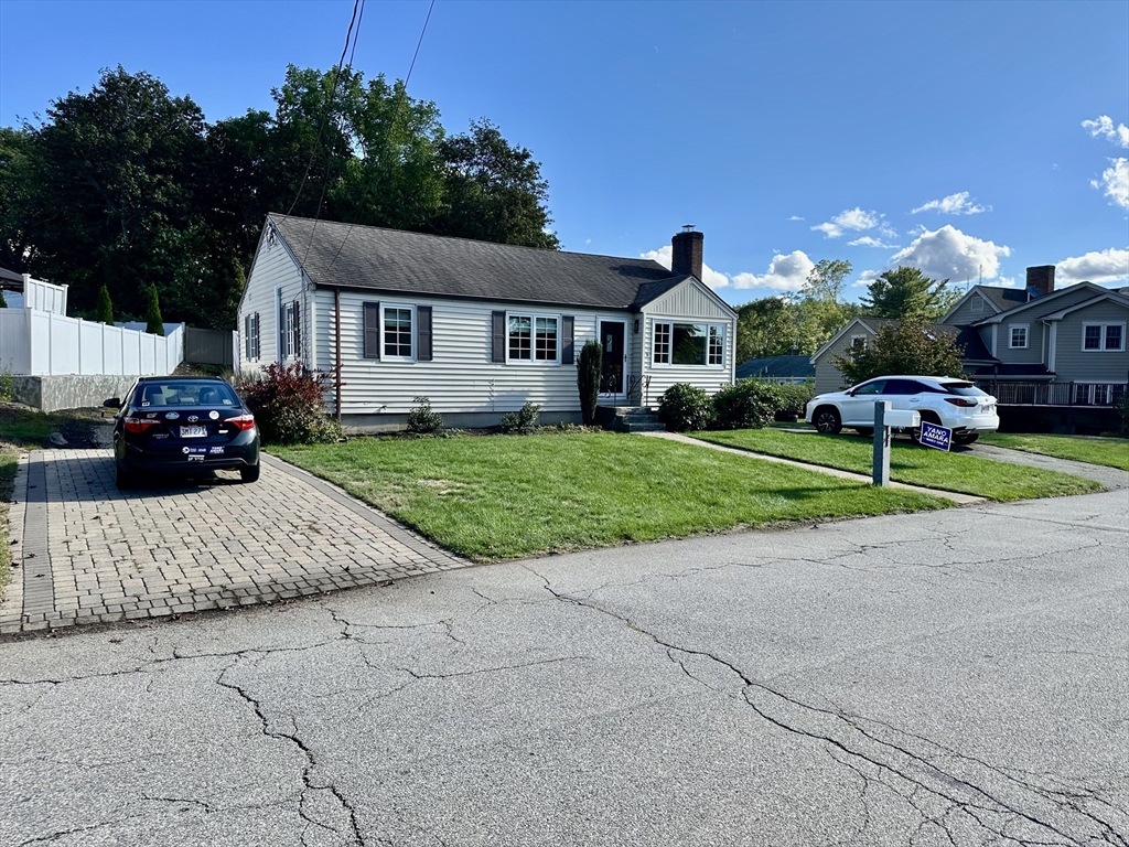 3 Day Circle Woburn, MA 01801 - Photo 41 of 42 a front view of a house with a yard and garage