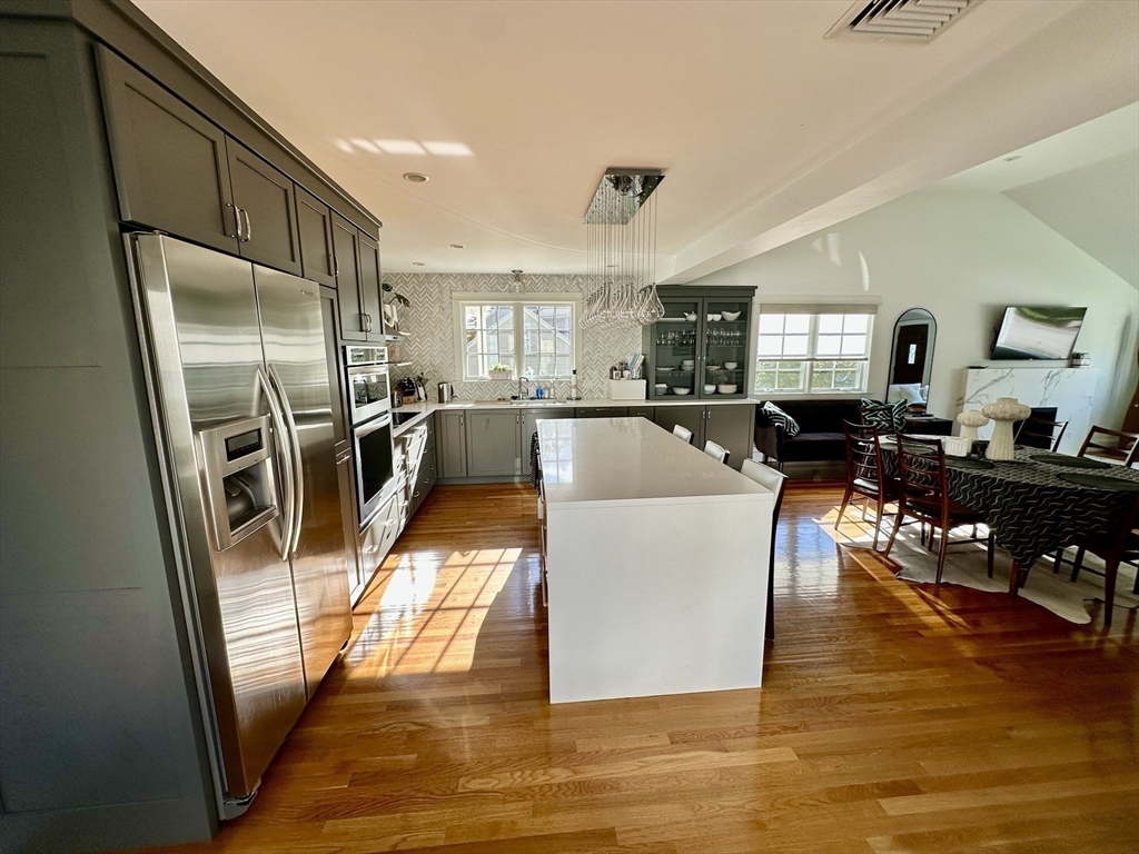 3 Day Circle Woburn, MA 01801 - Photo 6 of 42 a living room with stainless steel appliances furniture or kitchen view and a refrigerator