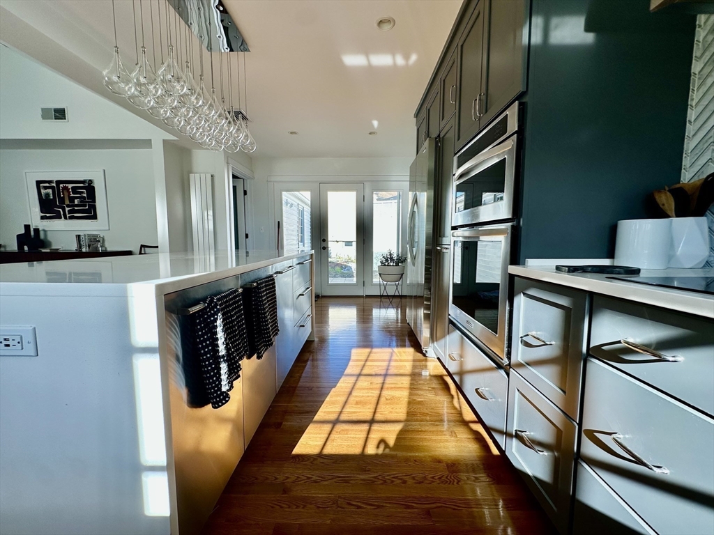 3 Day Circle Woburn, MA 01801 - Photo 9 of 42 a living room with furniture flat screen tv and a table