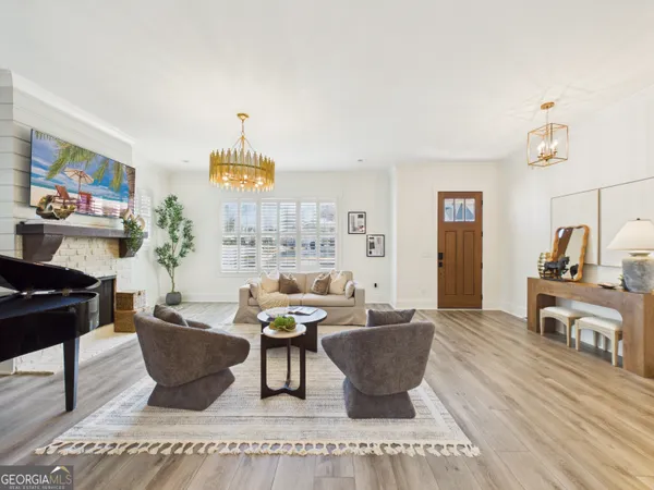 a view of a kitchen with a table and chairs