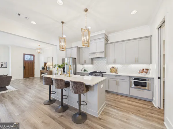 a view of a dining room with furniture and wooden floor