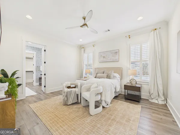 a bedroom with furniture and a flat screen tv