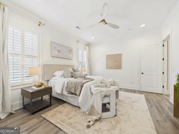 a spacious bathroom with a double vanity sink a large mirror a bathtub and shower