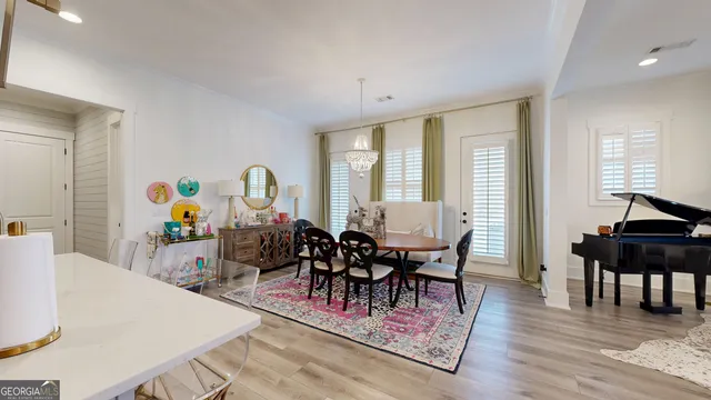 a kitchen with granite countertop a stove and a wooden floor