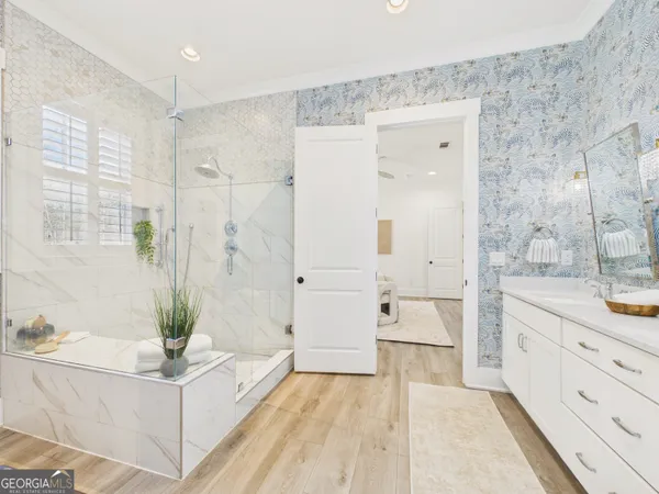 a bathroom with a bathtub and a shower
