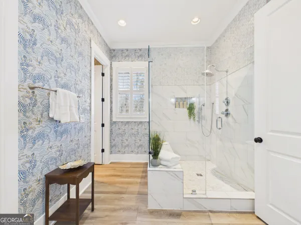 a bathroom with a bathtub and shower