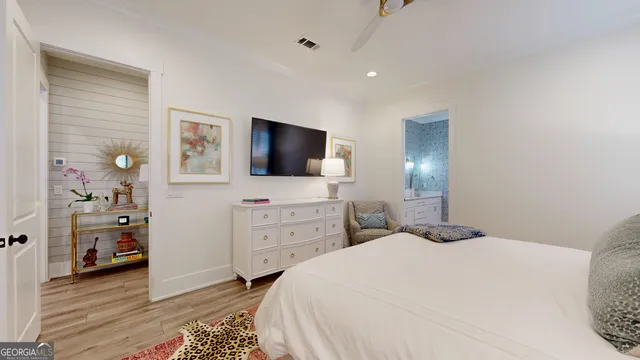 a bedroom with a bed and a dresser