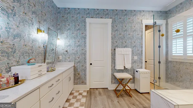 a bathroom with a bathtub and a sink