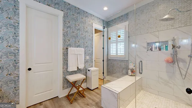 a bathroom with a bathtub and a shower