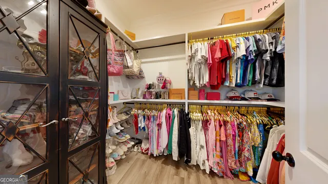 a spacious bathroom with a shower and mirror