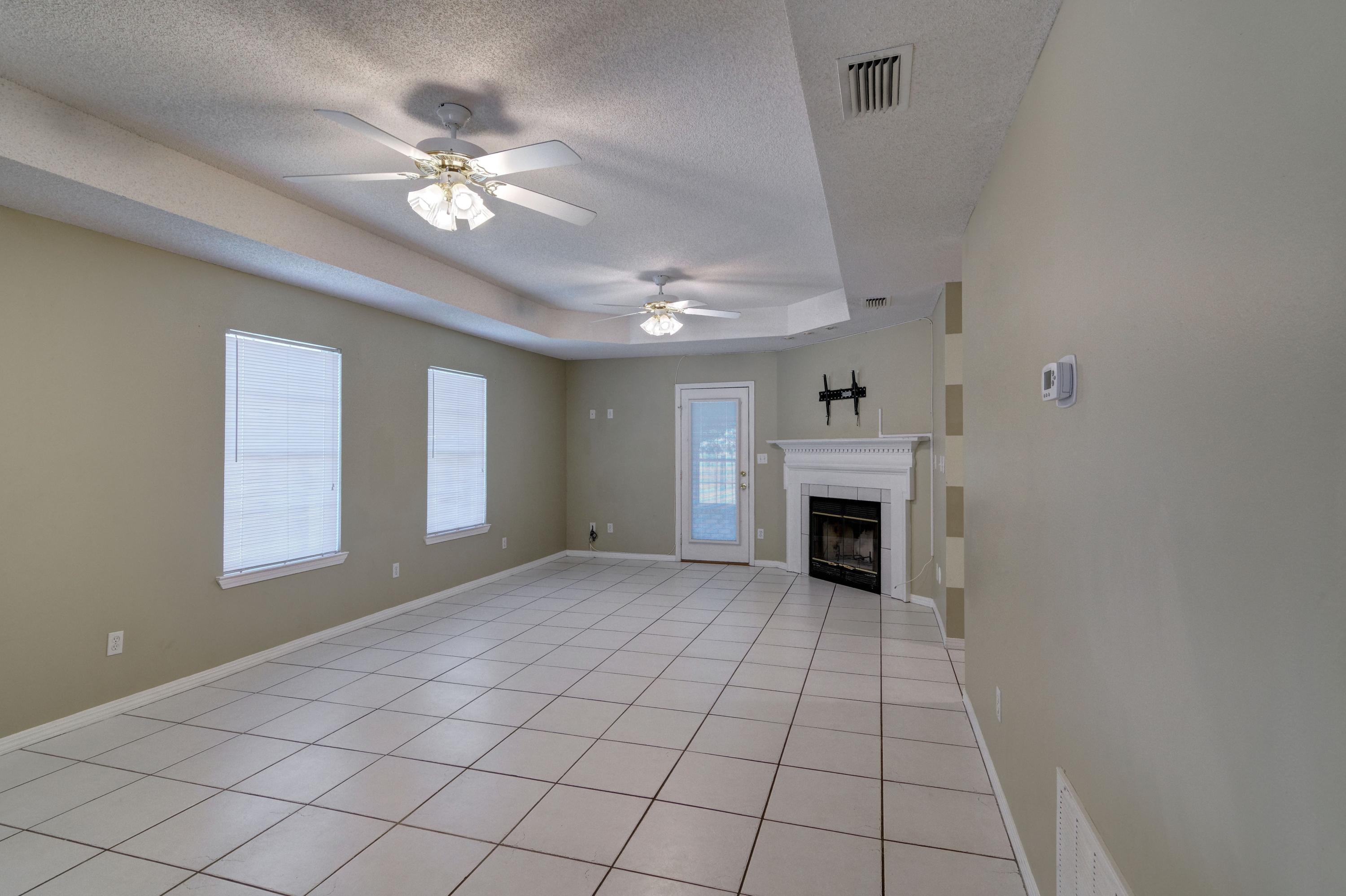 1774 Old Ranch Road Fort Walton Beach, FL 32547 - Photo 16 of 47 a view of an empty room with window and fireplace