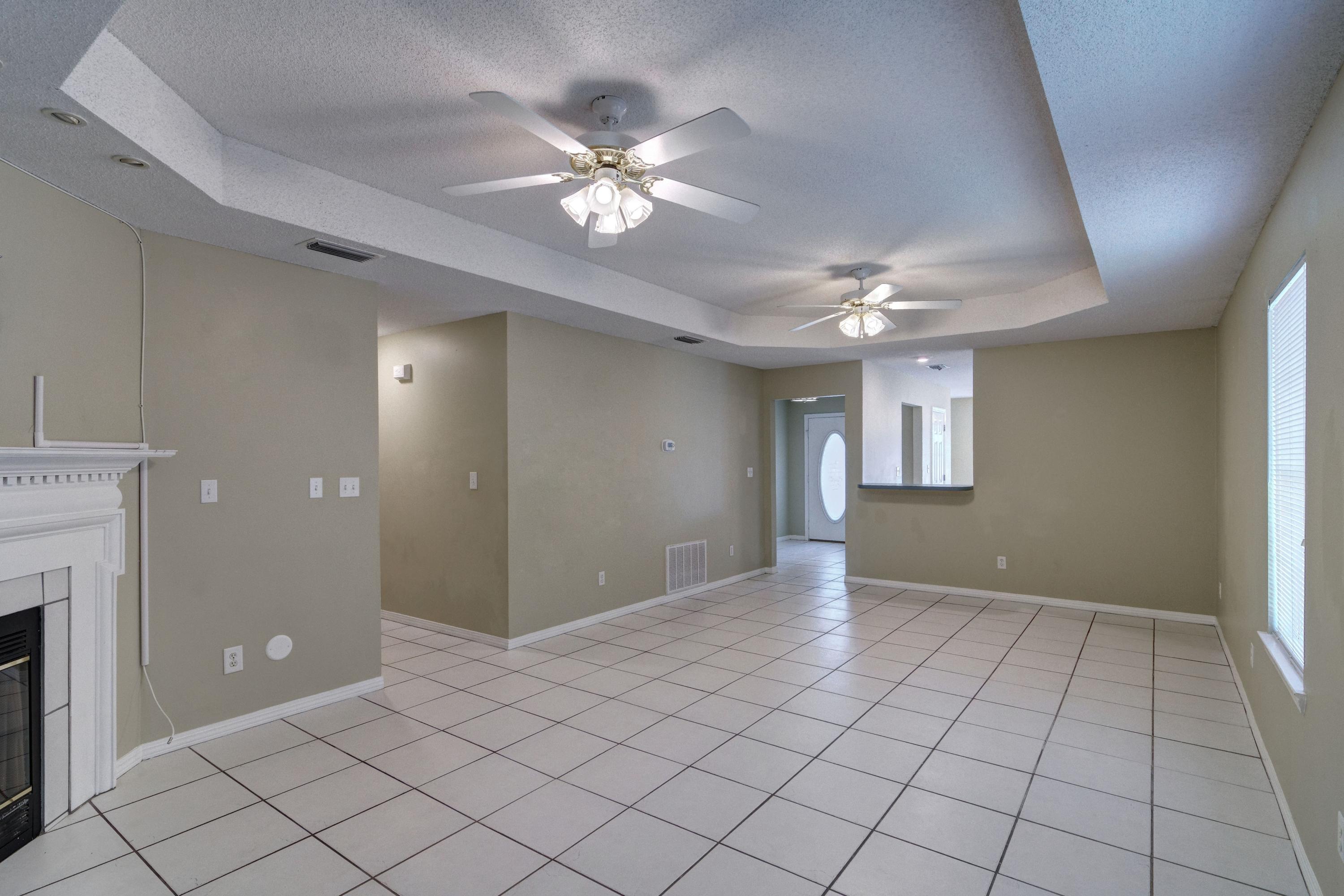 1774 Old Ranch Road Fort Walton Beach, FL 32547 - Photo 18 of 47 a view of an empty room and chandelier fan