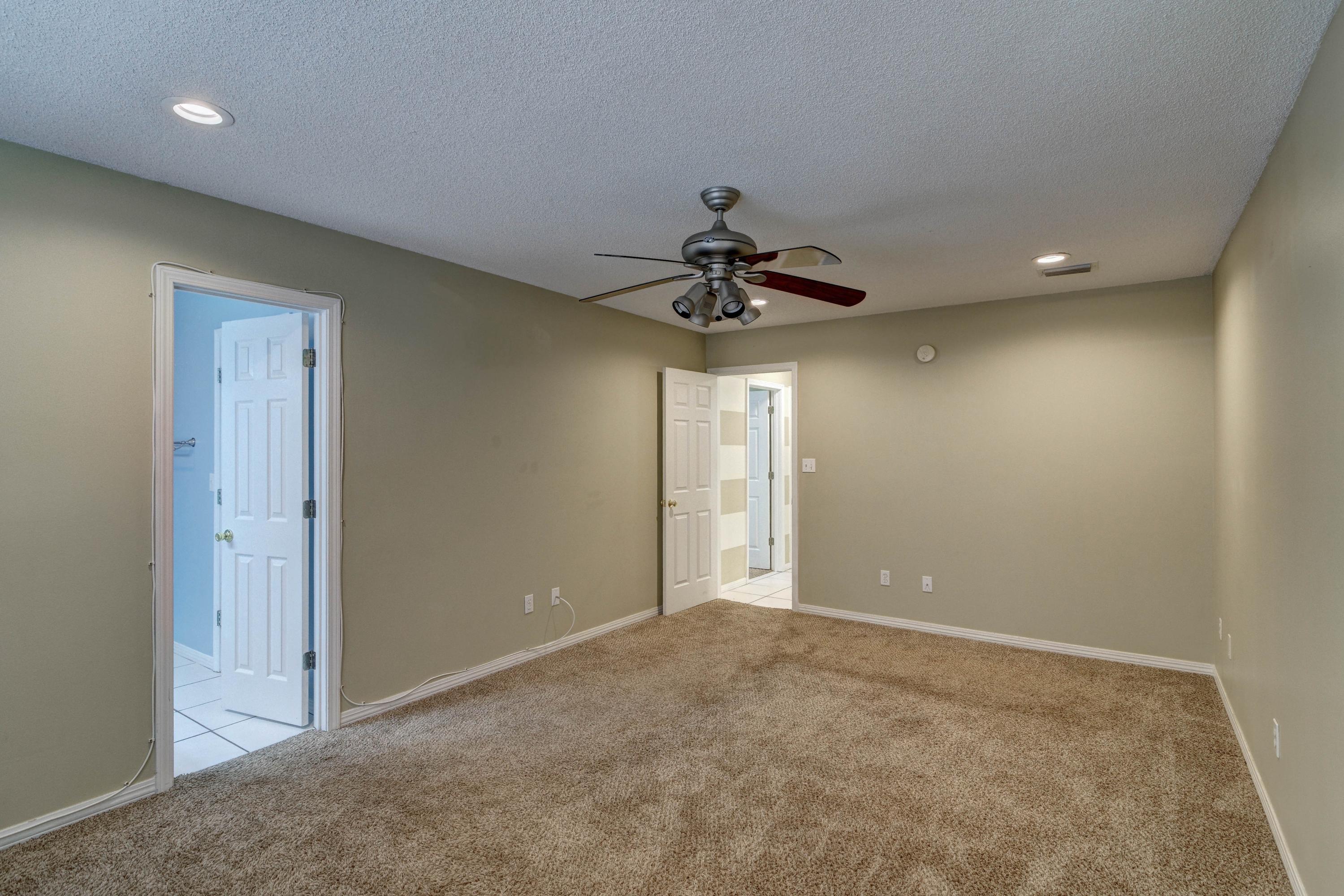 1774 Old Ranch Road Fort Walton Beach, FL 32547 - Photo 23 of 47 a view of an empty room and a ceiling fan