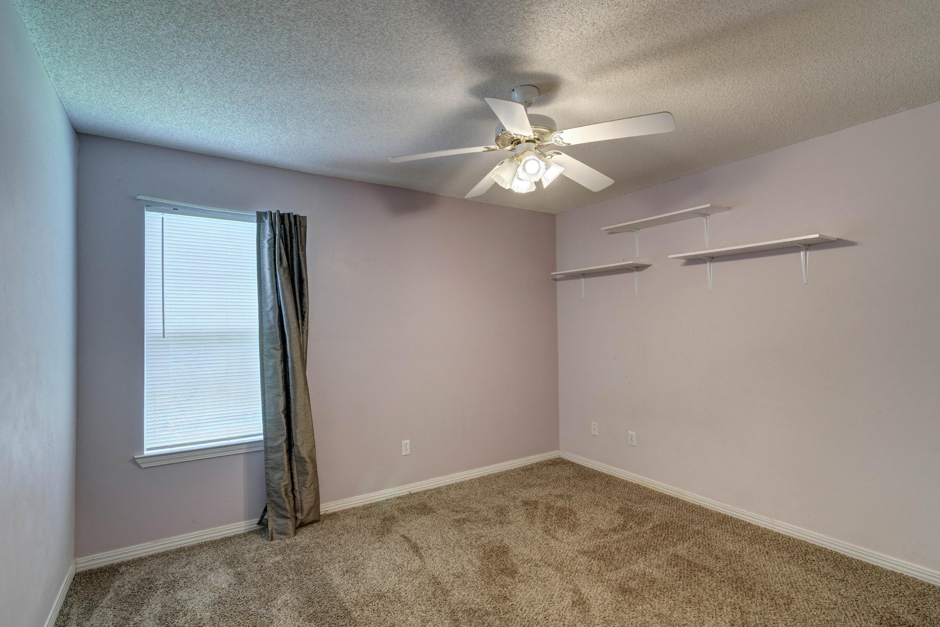 1774 Old Ranch Road Fort Walton Beach, FL 32547 - Photo 30 of 47 an empty room with a window and a fan