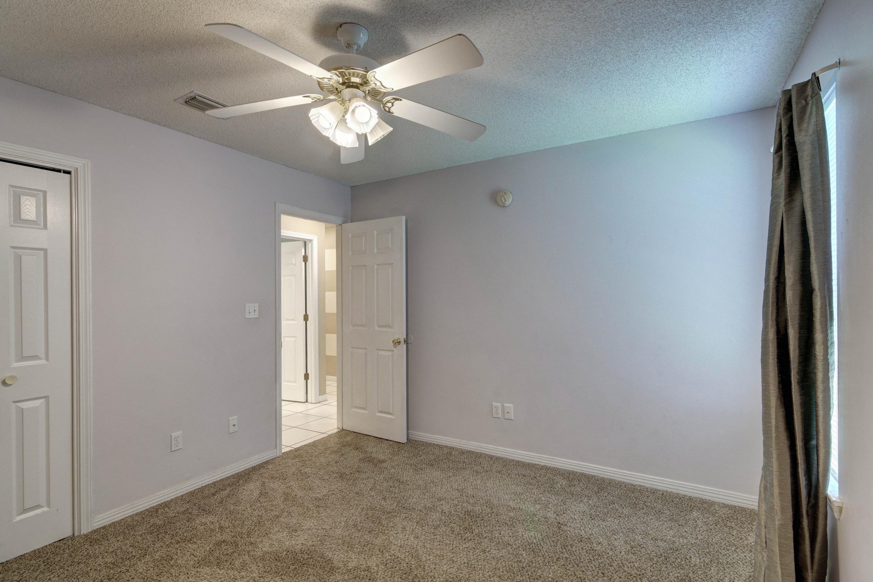 1774 Old Ranch Road Fort Walton Beach, FL 32547 - Photo 32 of 47 an empty room with windows and fan