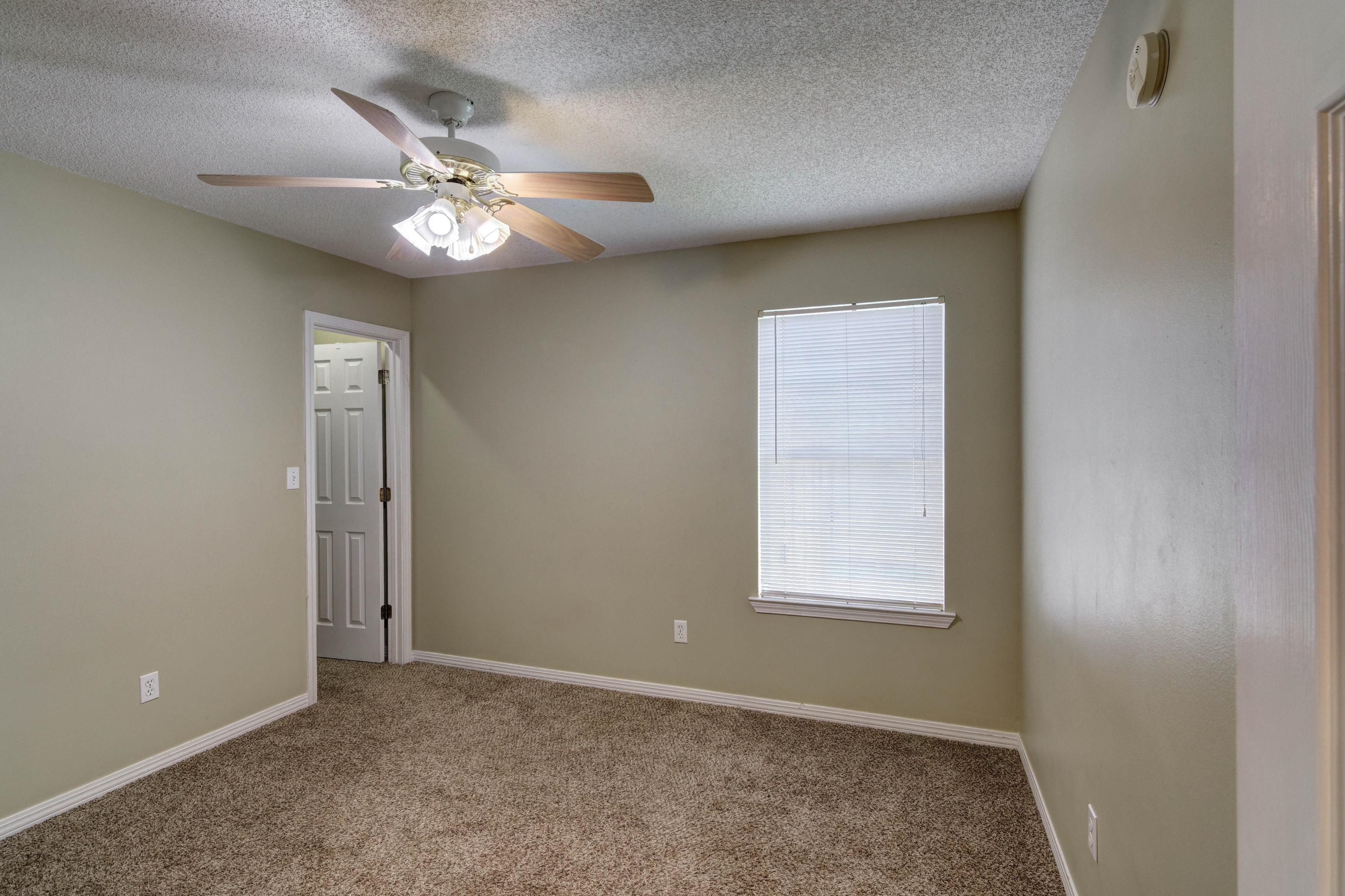 1774 Old Ranch Road Fort Walton Beach, FL 32547 - Photo 35 of 47 an empty room with windows and fan