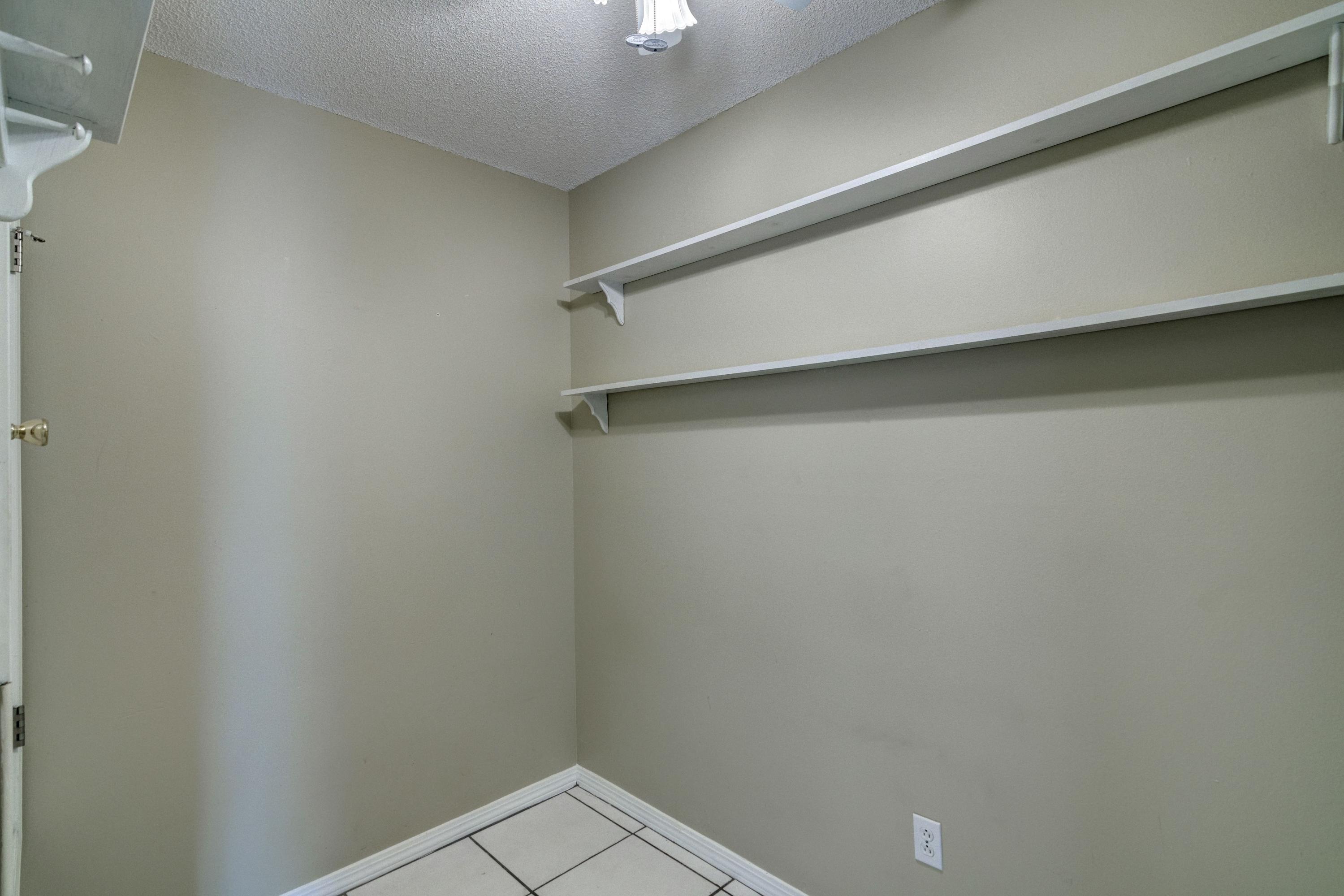 1774 Old Ranch Road Fort Walton Beach, FL 32547 - Photo 38 of 47 a view of an empty walk in closet
