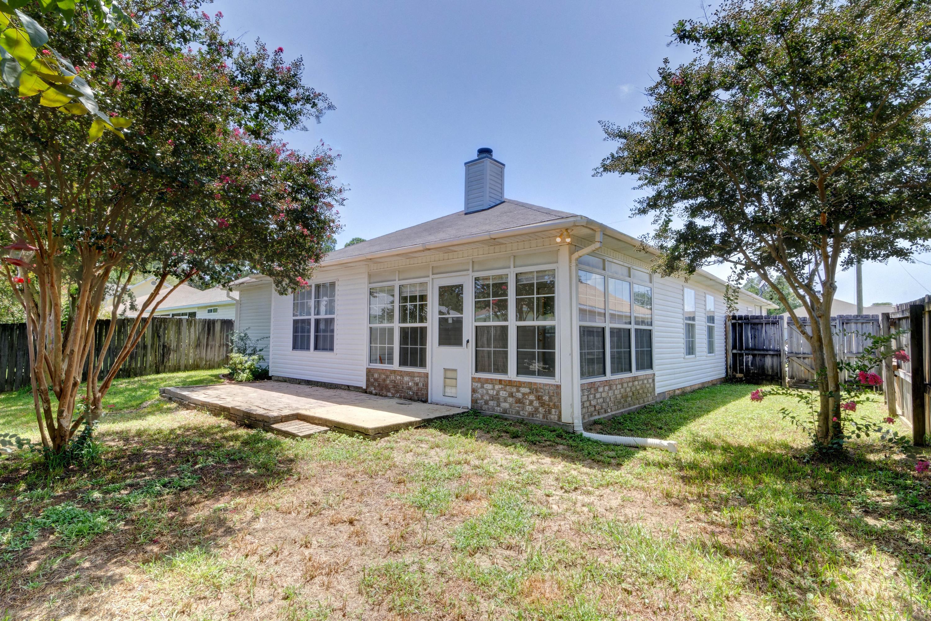 1774 Old Ranch Road Fort Walton Beach, FL 32547 - Photo 42 of 47 a front view of a house with a yard