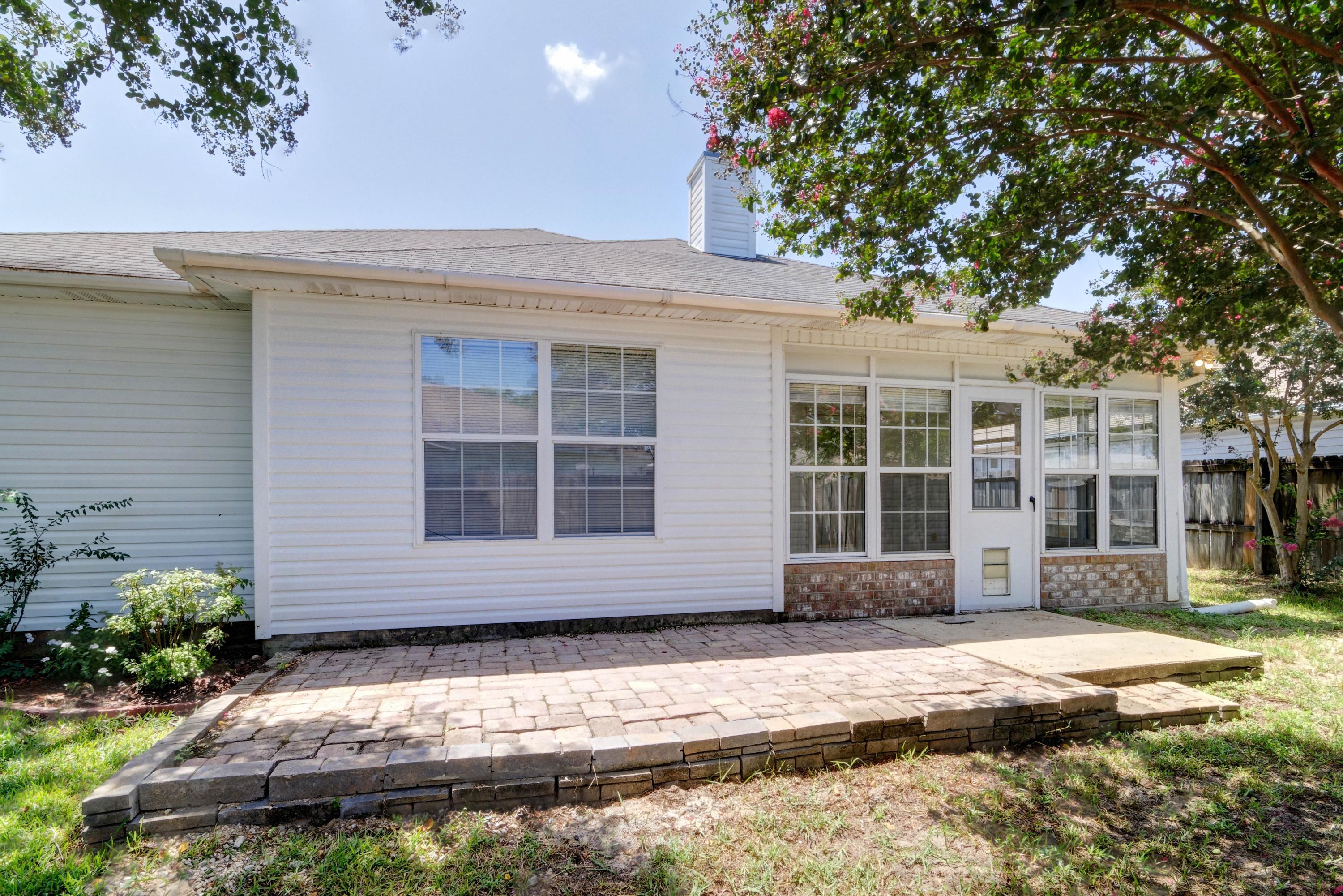 1774 Old Ranch Road Fort Walton Beach, FL 32547 - Photo 43 of 47 a front view of a house with a yard and garage