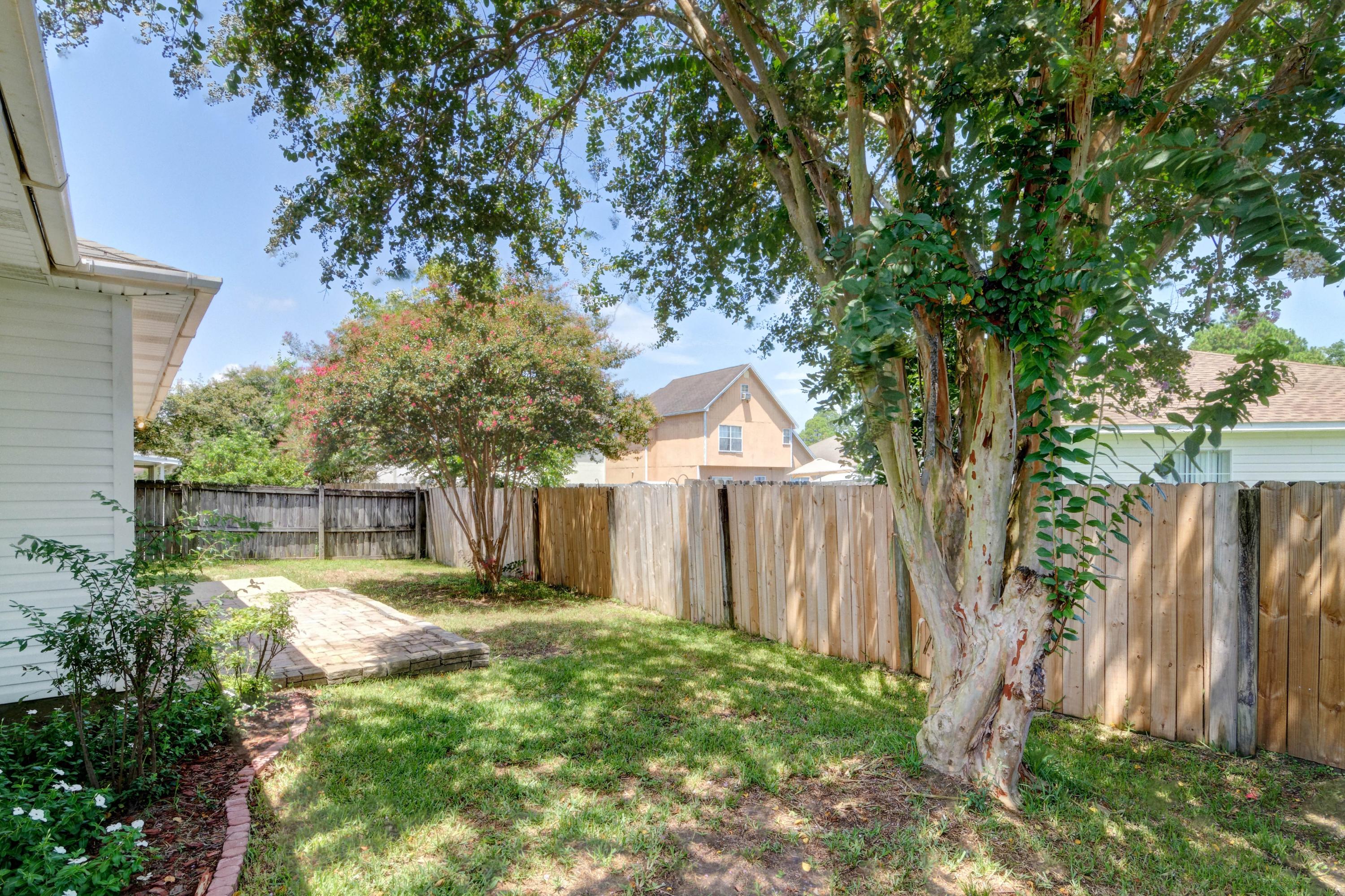 1774 Old Ranch Road Fort Walton Beach, FL 32547 - Photo 45 of 47 a view of a backyard with large trees and wooden fence