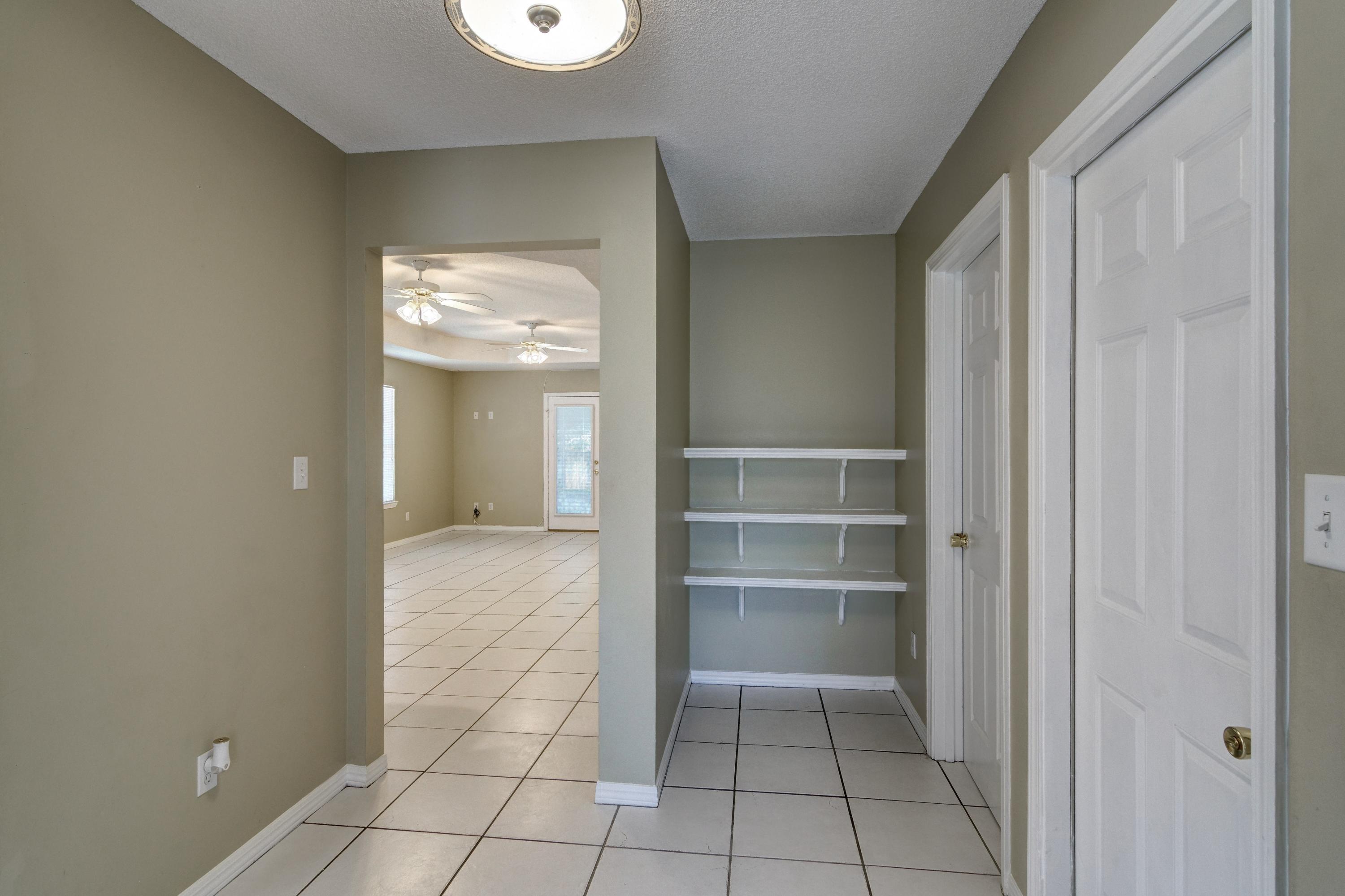 1774 Old Ranch Road Fort Walton Beach, FL 32547 - Photo 5 of 47 a view of an empty room with a window