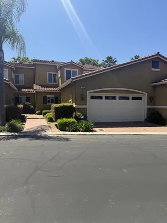 front view of a house with a street
